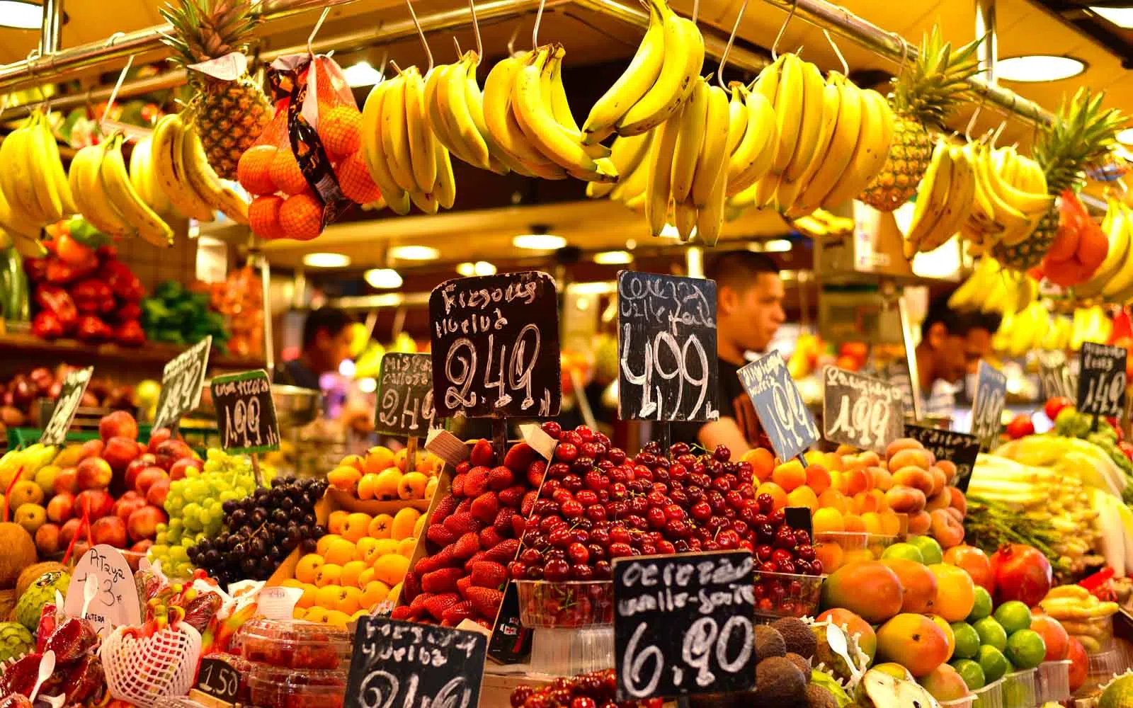 a fruit stand at boqueria market barcelona