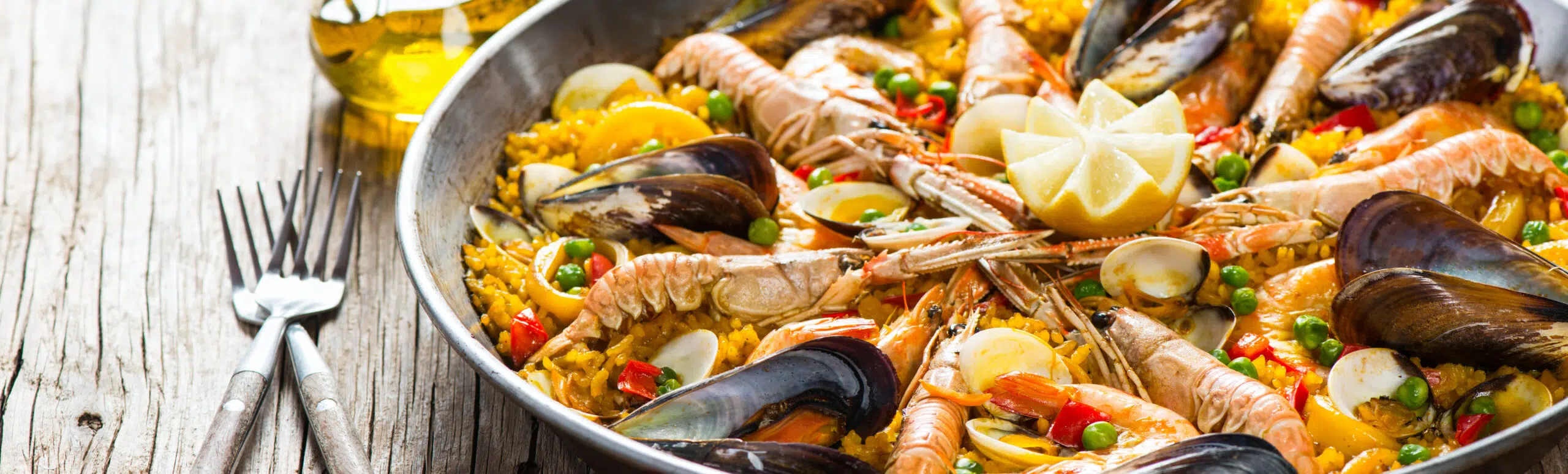 a pan of seafood paella at bodega joan restaurant in barcelona spain