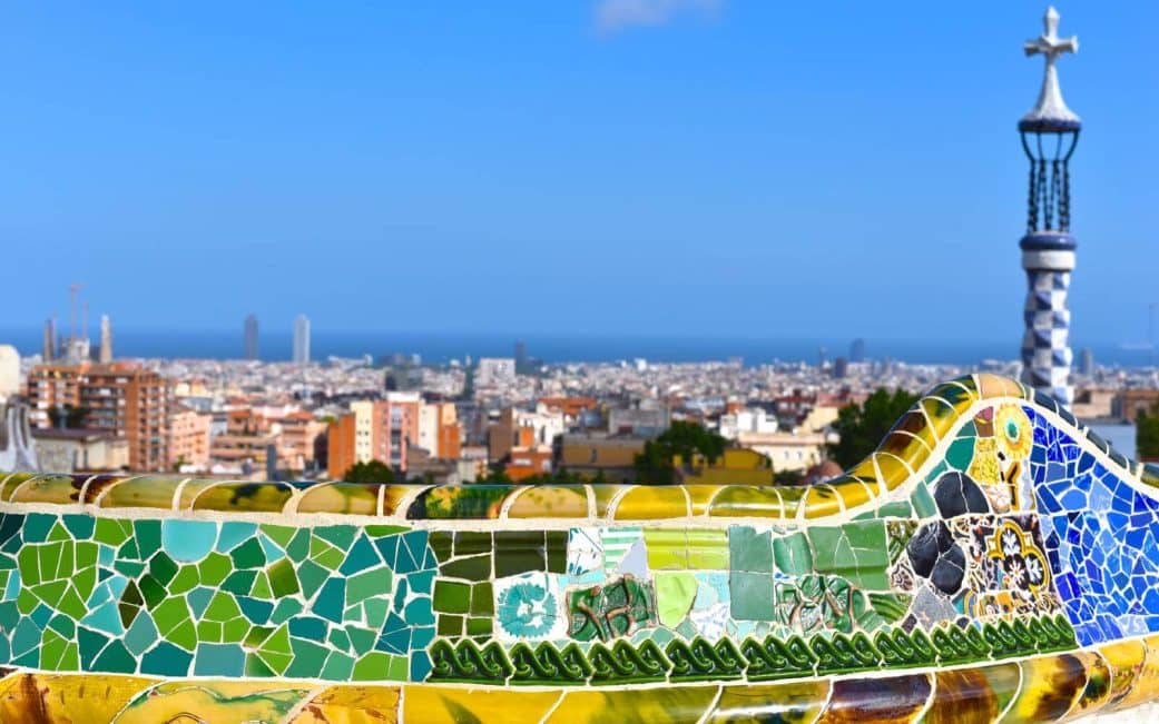 the moasaic benches at park guell with panoramic view of the mediterranean sea