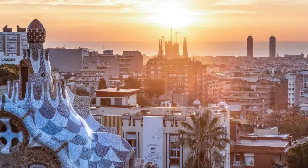 view of sagrada familia at sunset from park guell