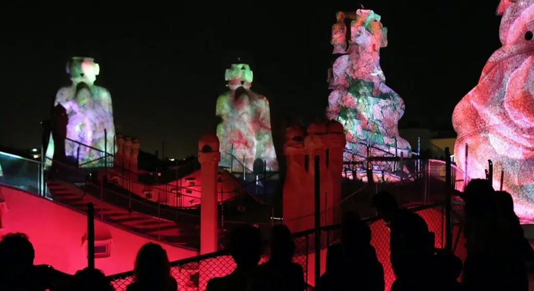 visitors watching projections on the rooftop of la pedrera in barcelona spain