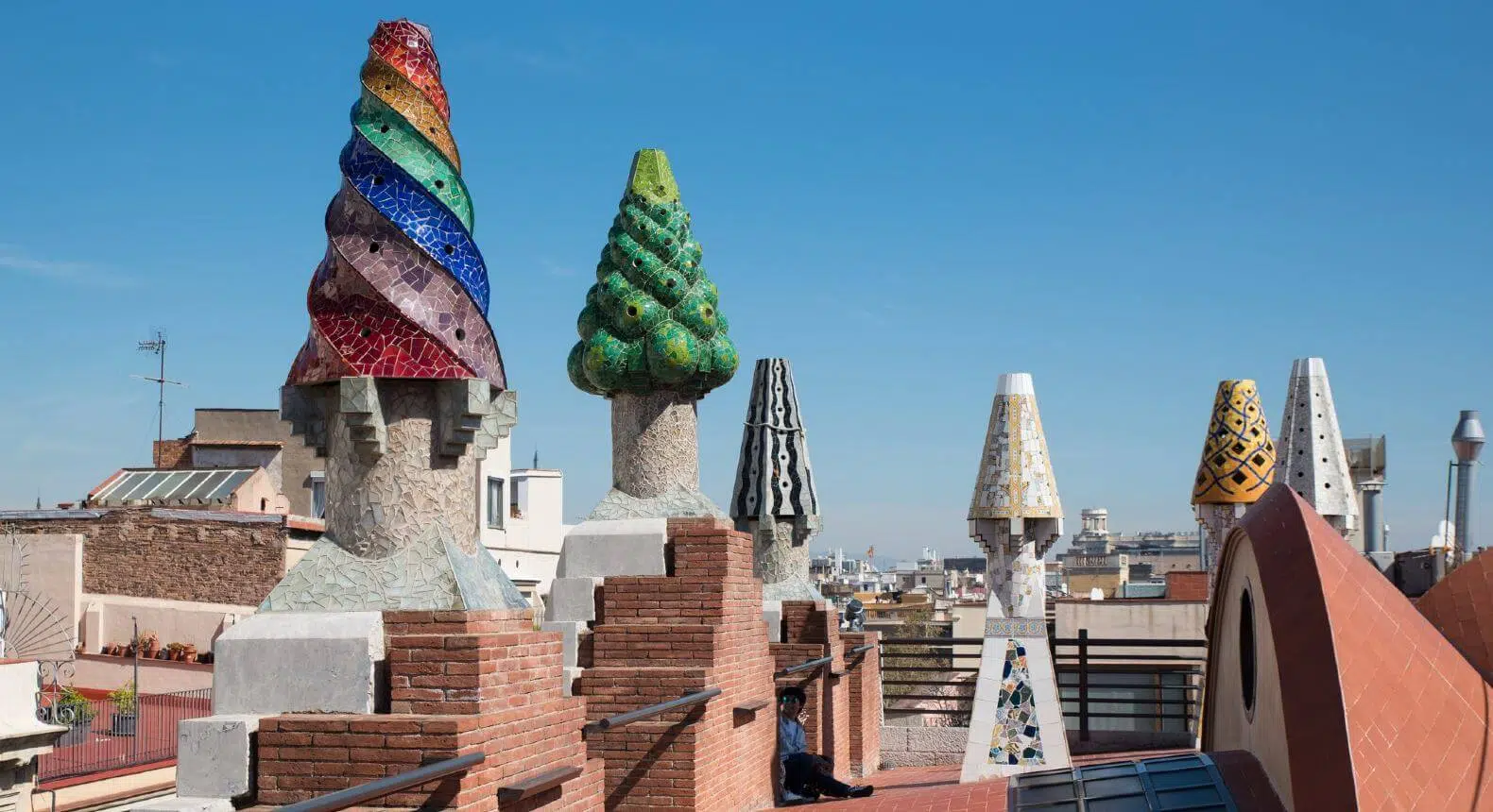 mosaic chimneys on the rooftop of palau guell barcelona