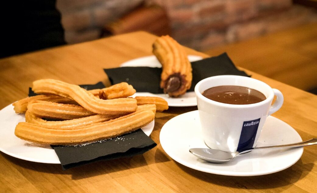 churros con chocolate served at a cafe in barcelona