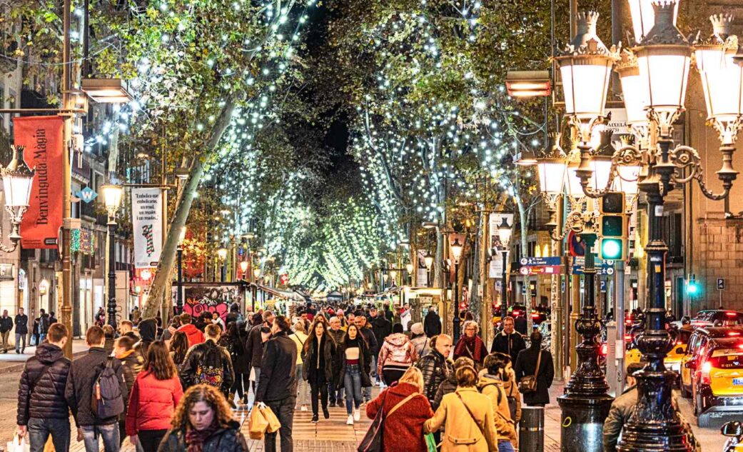 tourists walking down las ramblas in december in barcelona